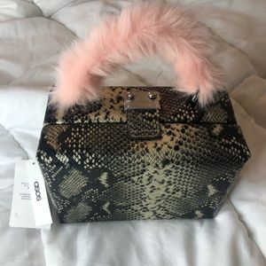 Snake print box bag with fur handle